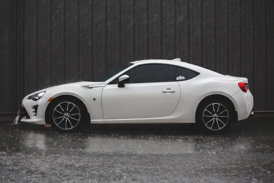 white car in the rain
